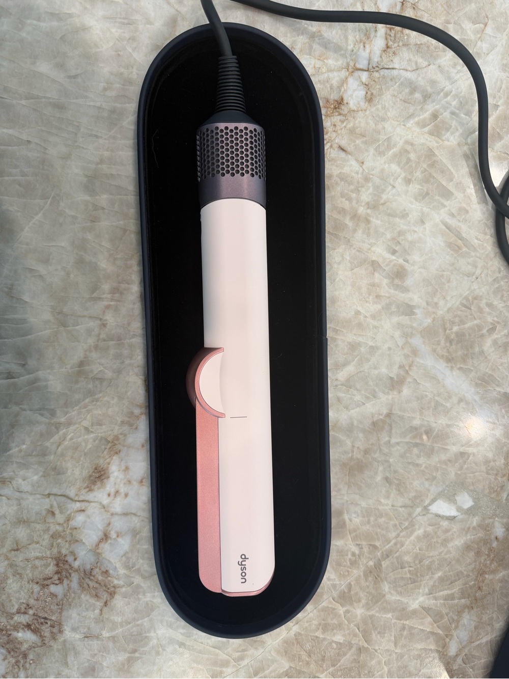 Dyson hair styler in blush pink with rose-gold accents
